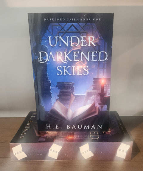 Under Darkened Skies (Book, 1) by H.E. Bauman Sprayed Edge Paperback